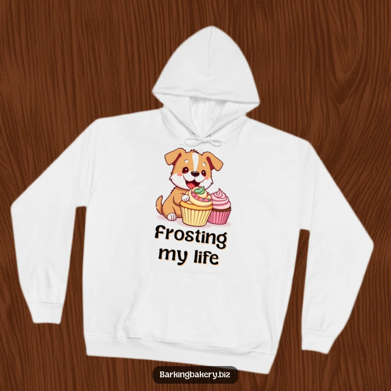 Funny Hoodie: A cheerful dog artistically applies vibrant frosting to a cupcake, bringing smiles and warmth.
