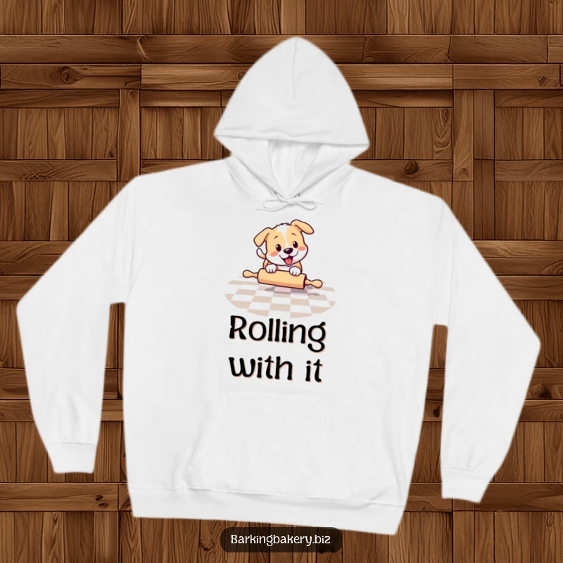 Funny dog chasing a rolling pin, wearing a cozy hoodie, ideal for a funny pet lover gift.