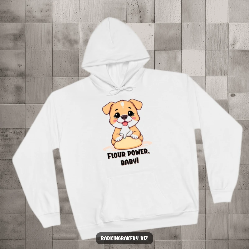 Funny dog hoodie featuring a happy, flour-covered puppy enthusiastically kneading a ball of dough, a perfect baking buddy.
