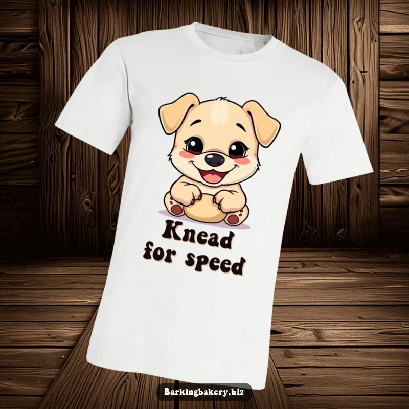 Funny puppy with a big grin happily kneads dough using its small paws on a funny t-shirt.