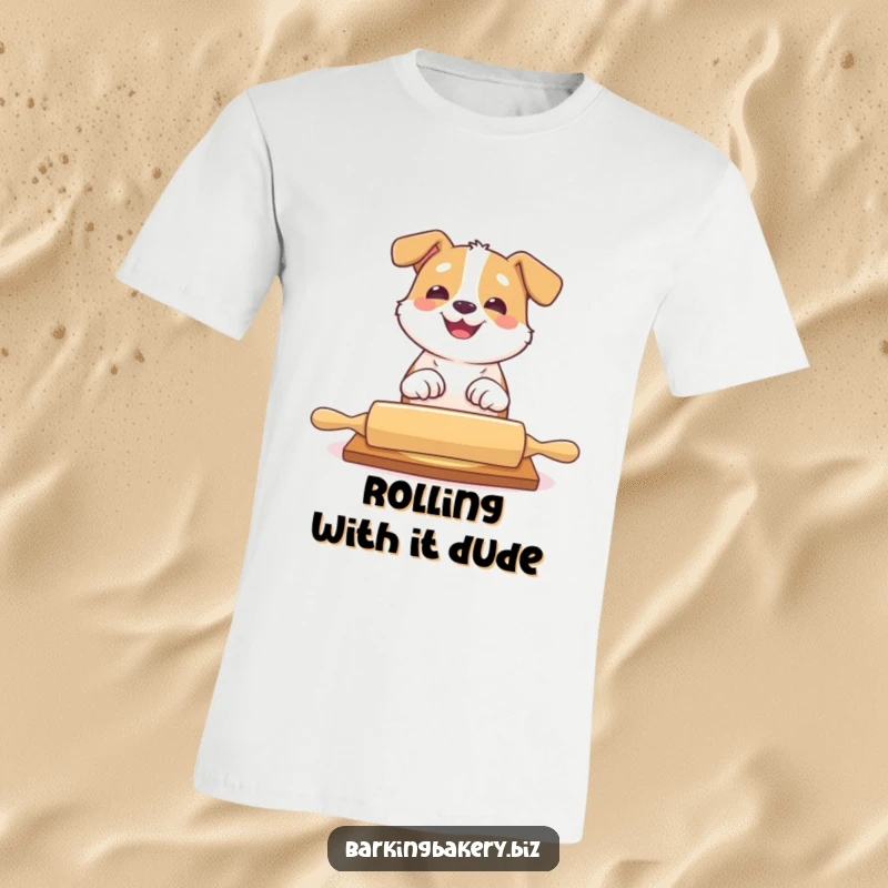 Funny dog t-shirt featuring a happy dog playfully batting at a rolling pin with a big grin, a baker's helper.