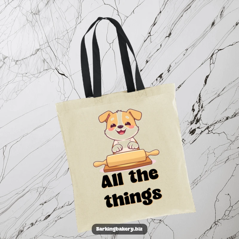 Funny dog tote bag with a dog playfully batting at a rolling pin with a big grin, for baking supplies.